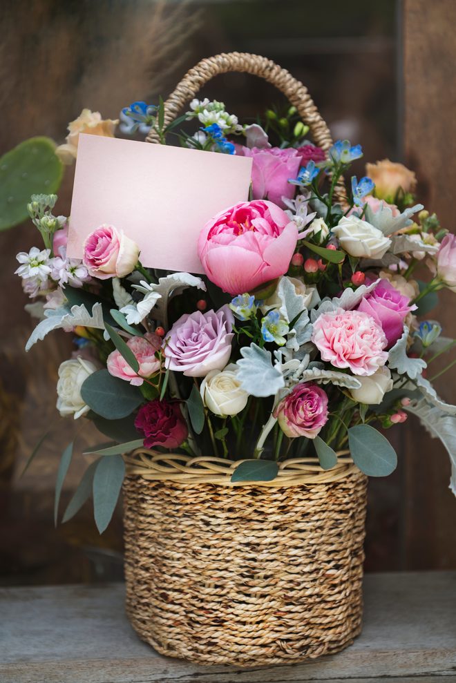 A spring bouquet with peonies, roses, and lilac accents