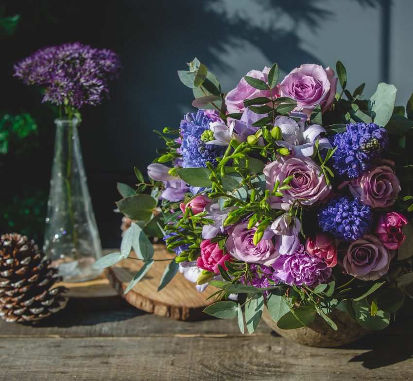 A bouquet with lavender, lisianthus, and roses